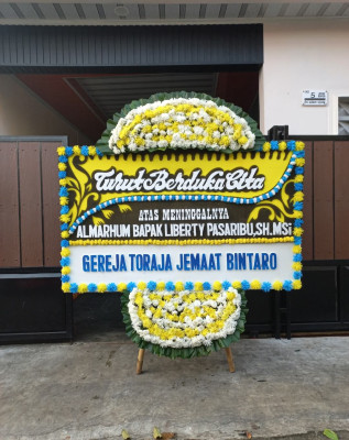 Papan Bunga Duka di Tirto