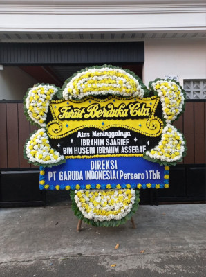 Papan Bunga Duka di Tirto